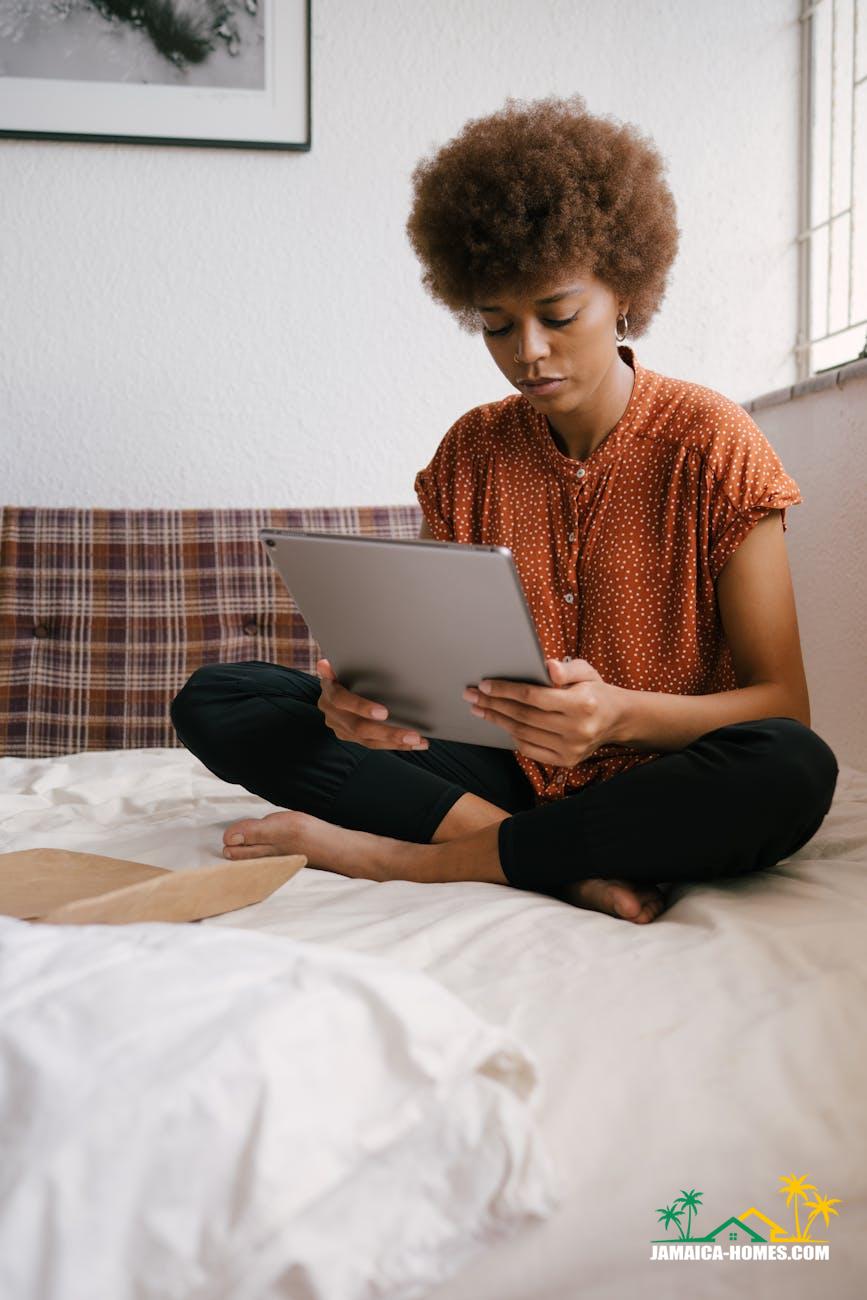 photo of woman holding tablet