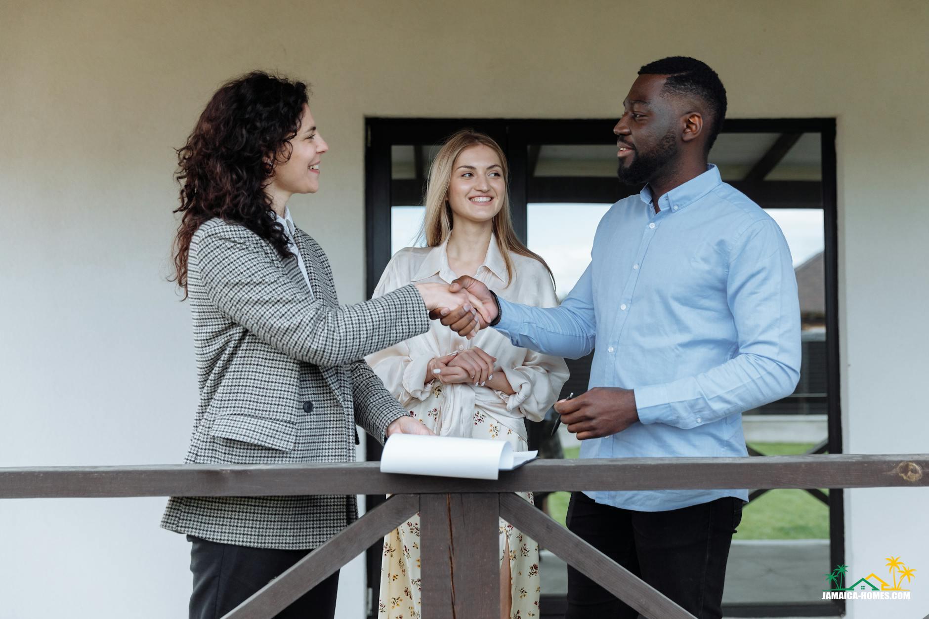 a man and a woman shaking each others hands